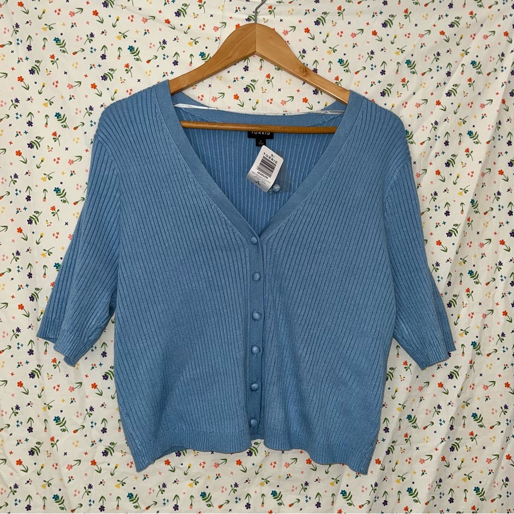 Brand new with tags. Pretty blue ribbed cropped cardigan from Torrid.